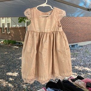 Pink sliver dress with little flower button on the back